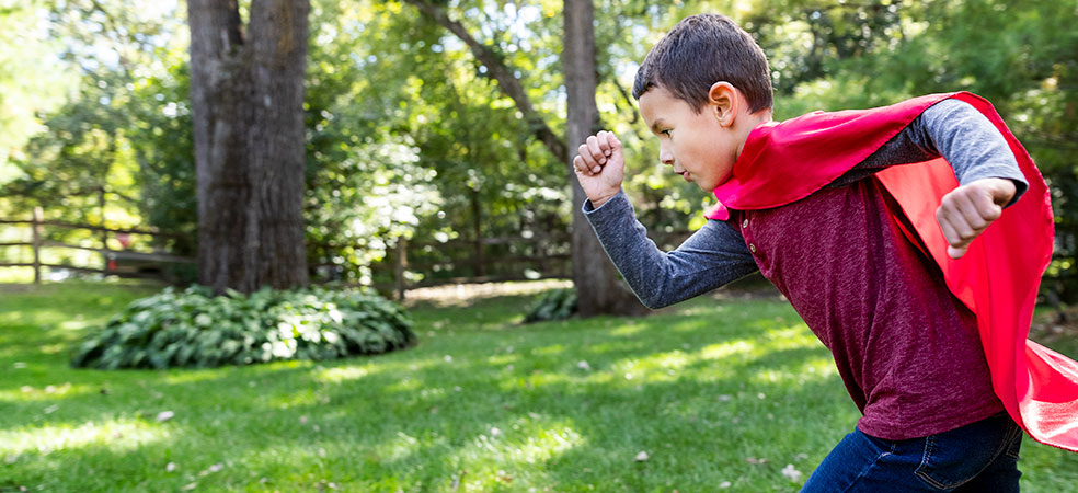 locations banner / boy running in a cape
