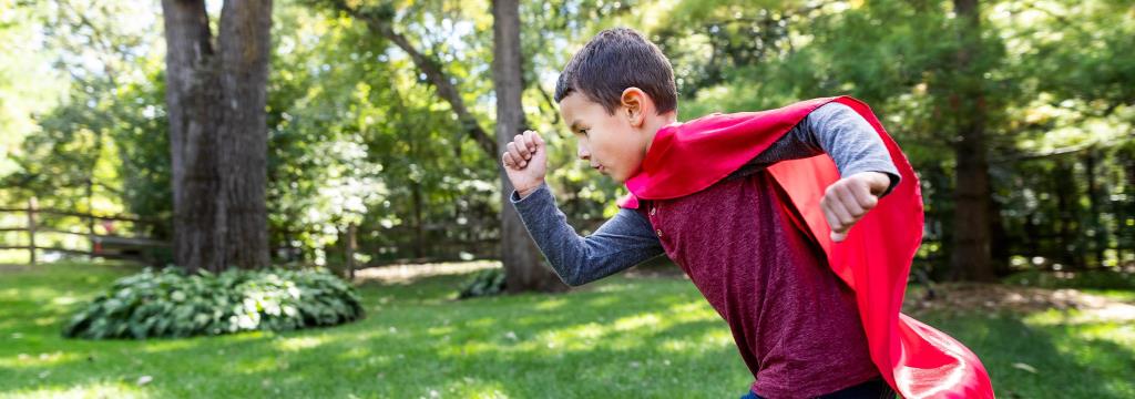 Marshfield Children's Hospital Hero Image / boy running in a super hero cape