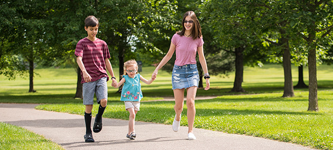 Colton, Chelsie and Caitlin walk through the park