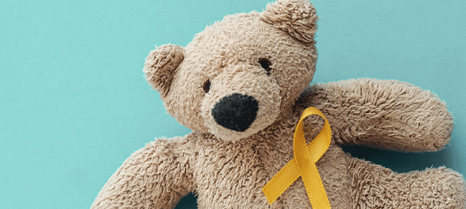 Image of teddy bear with yellow ribbon