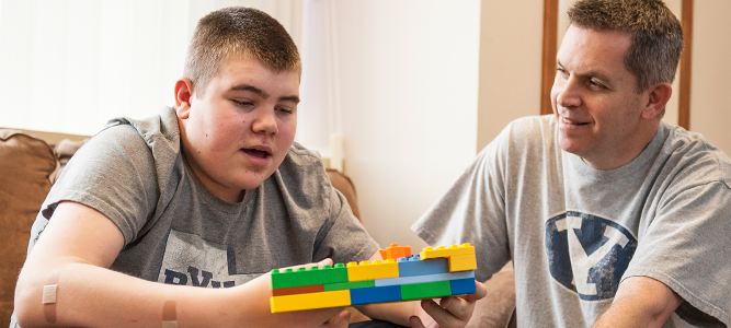 boy playing with duplo legos