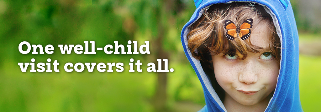 Image of child smiling with a butterfly on his head