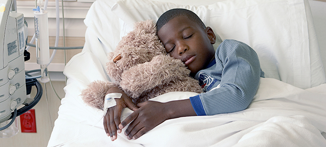 PICU / African American boy sleeping in Pediatric Intensive Care Unit 